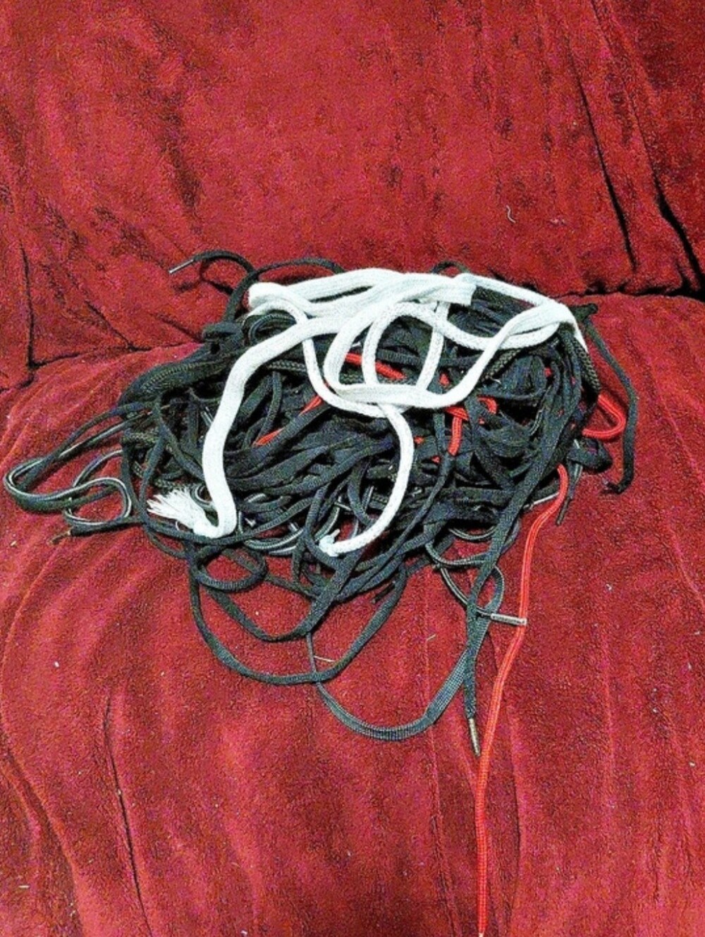 A Pile Of Different Colored Shoe Strings